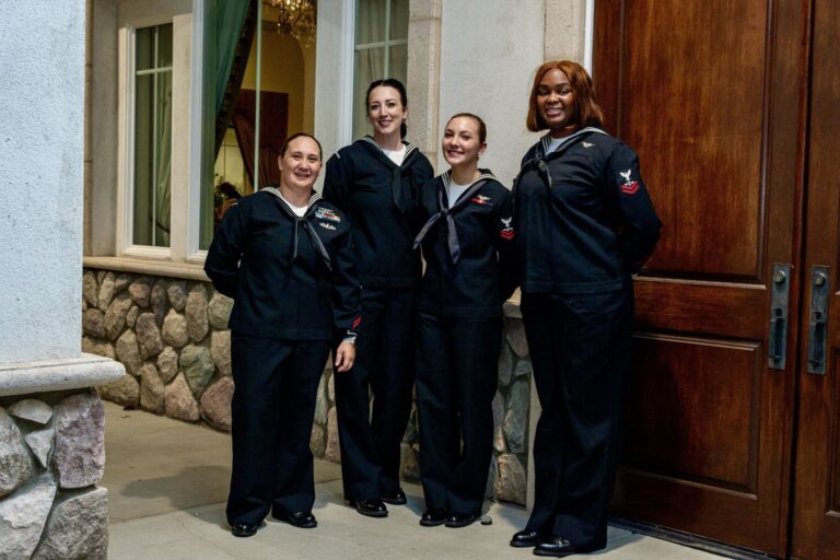 Four U.S. Navy sailors in dress blues at the 2025 Military Ball